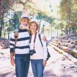 Senior family couple walking together on ancient sightseeing.