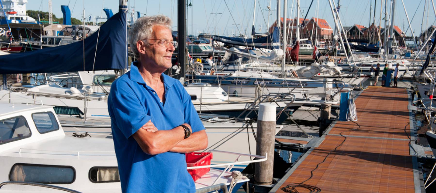 elderly retired man resting in harbor