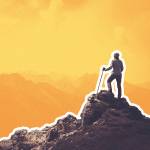 Woman hiker on a top of a mountain