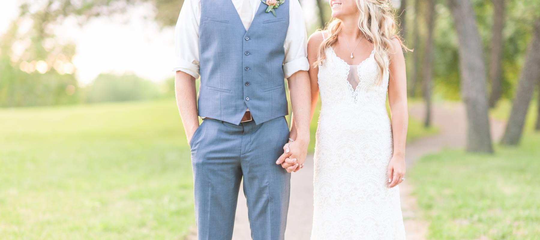 Excited first time homebuyers standing in front of their new home