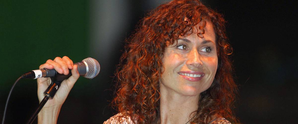 Minnie Driver with a microphone