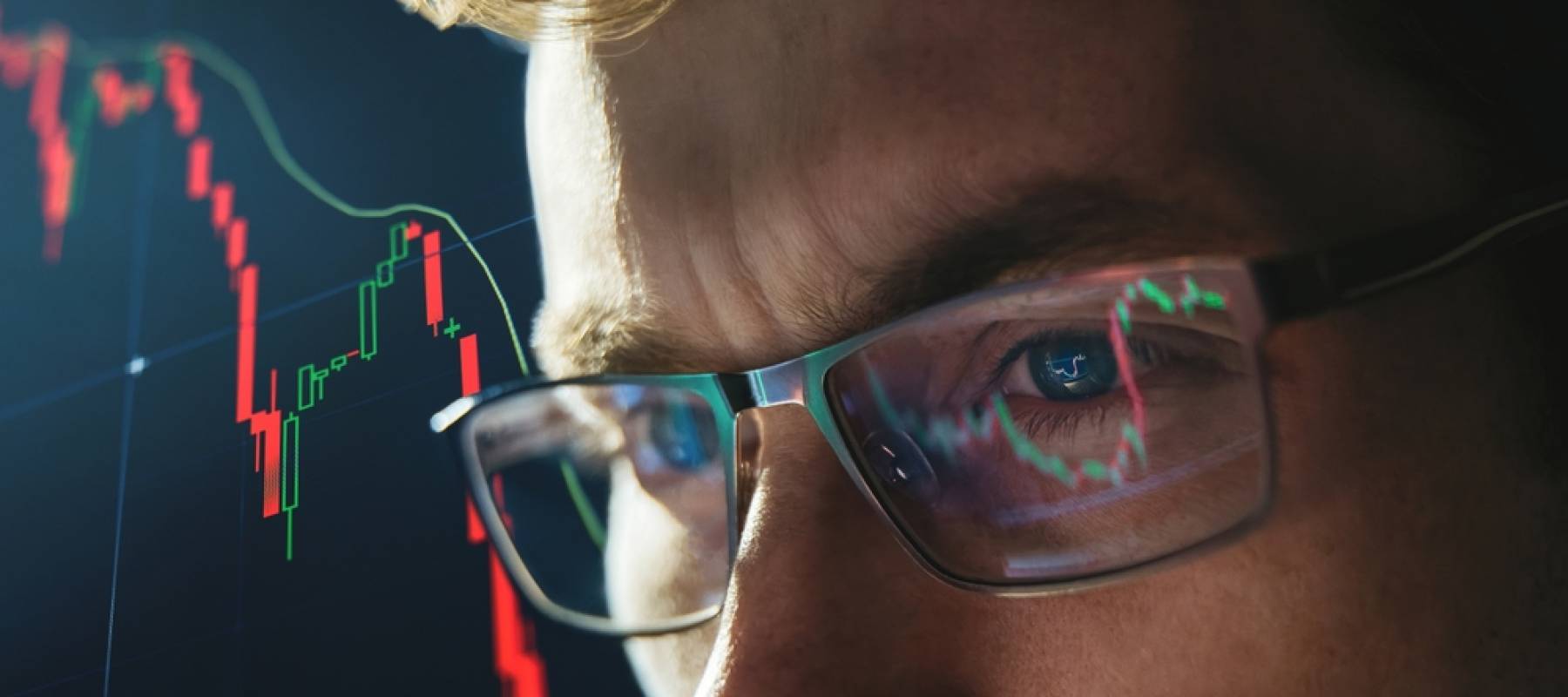 A man watches crypto currency value fall.