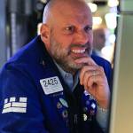 A trader works on the floor of the New York Stock Exchange (NYSE) at the opening bell in New York City, on April 7, 2025.