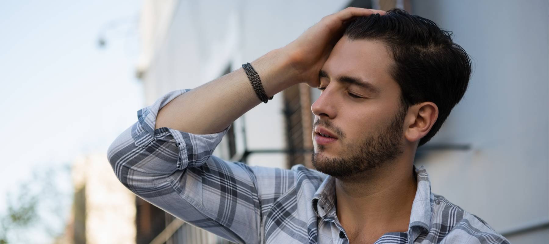 Tense young man ruminating.
