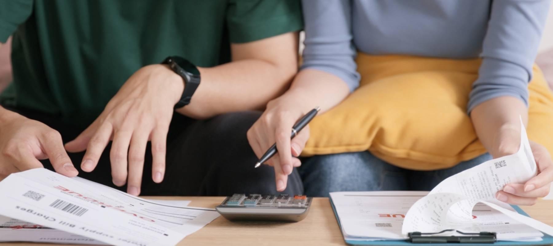 Couple looking at bills together.