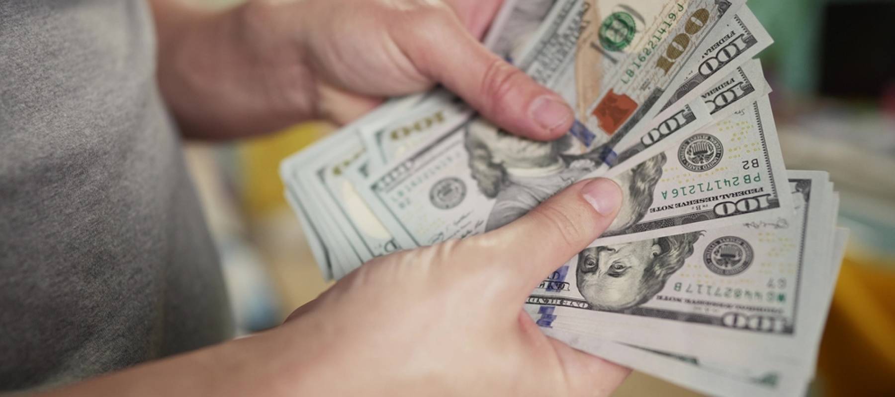 Person holding cash