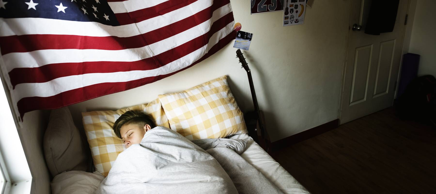 Kid sleeping in his bed