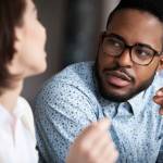 Close up of colleagues discussing something in office