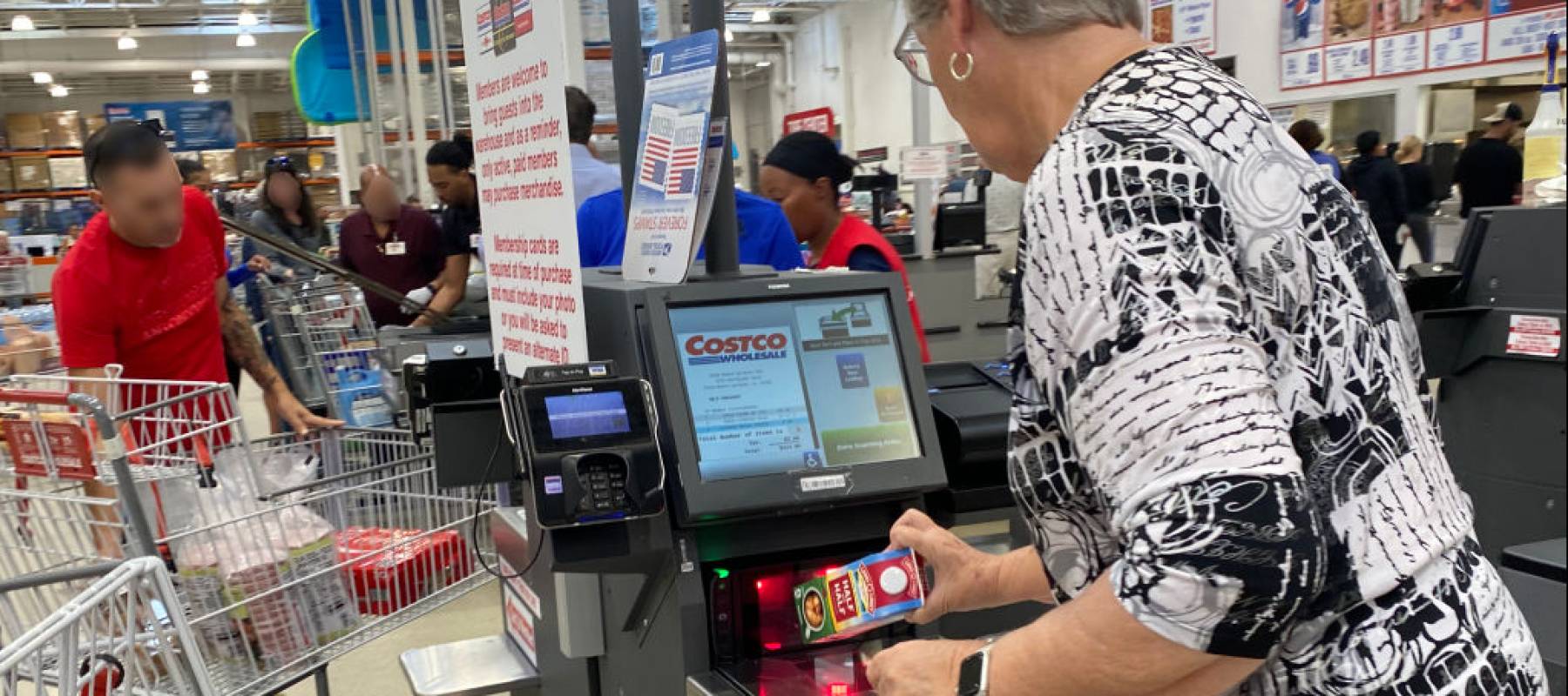 Woman checking out at Costco.