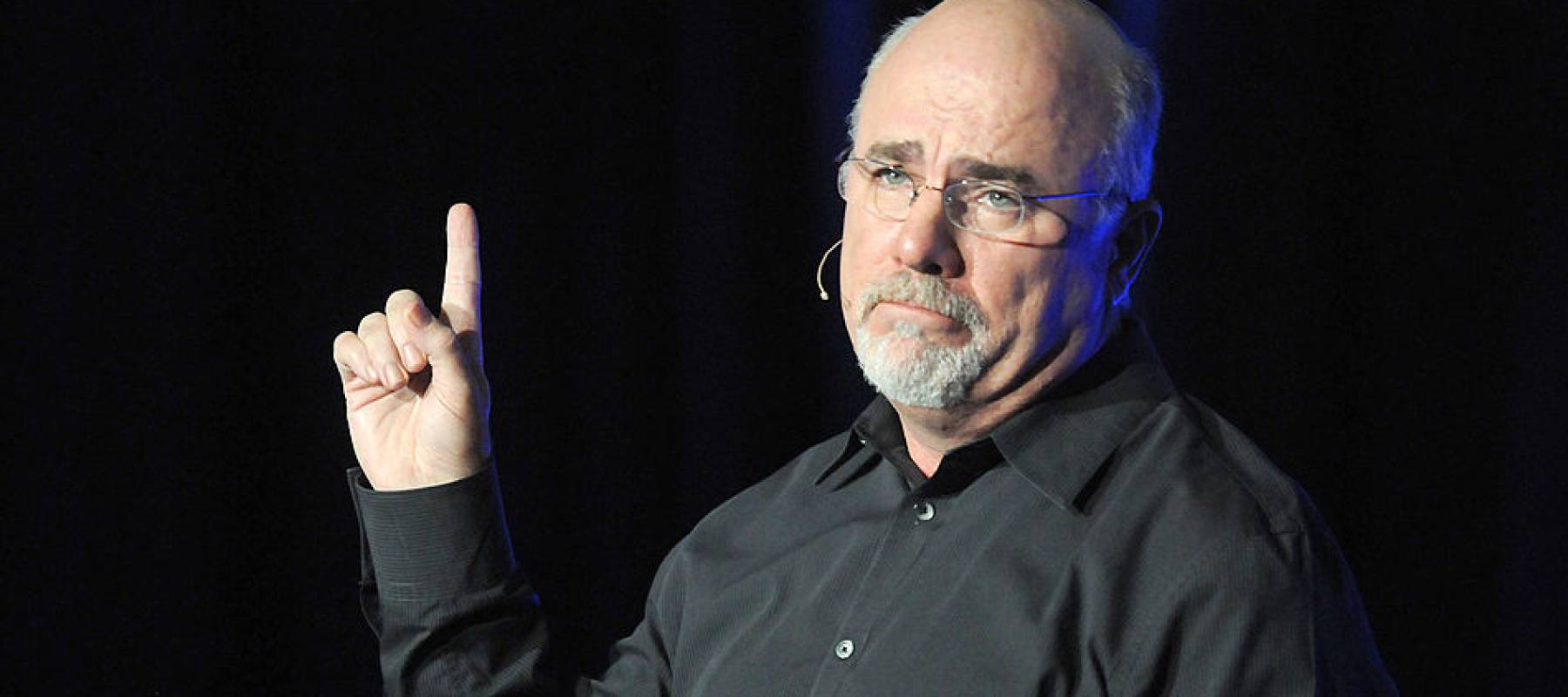 Dave Ramsay speaking on stage.