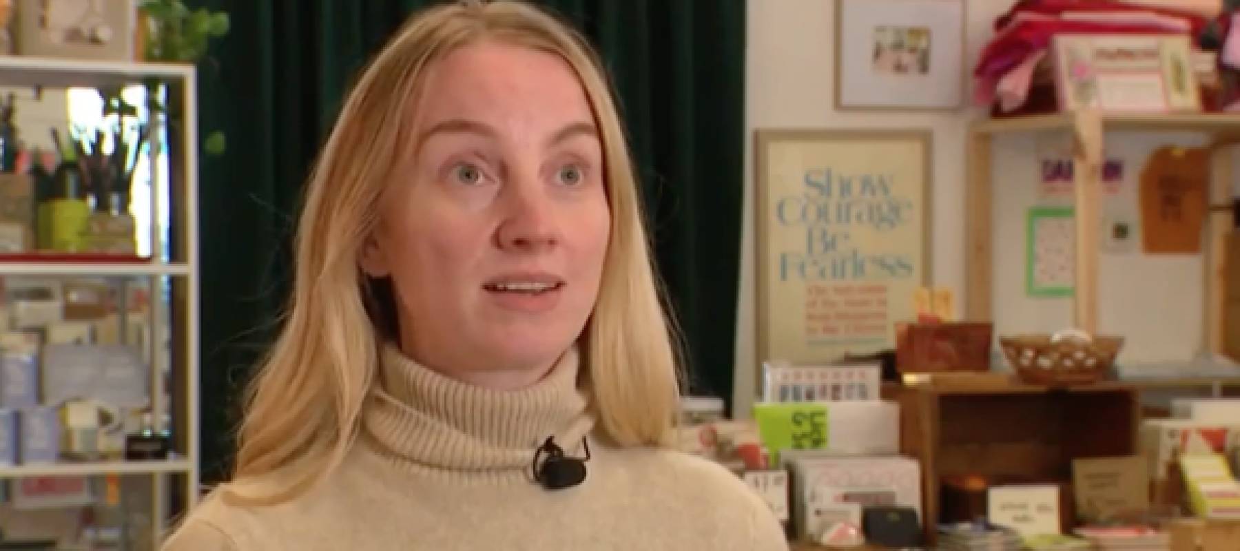 Shop owner speaks on camera.