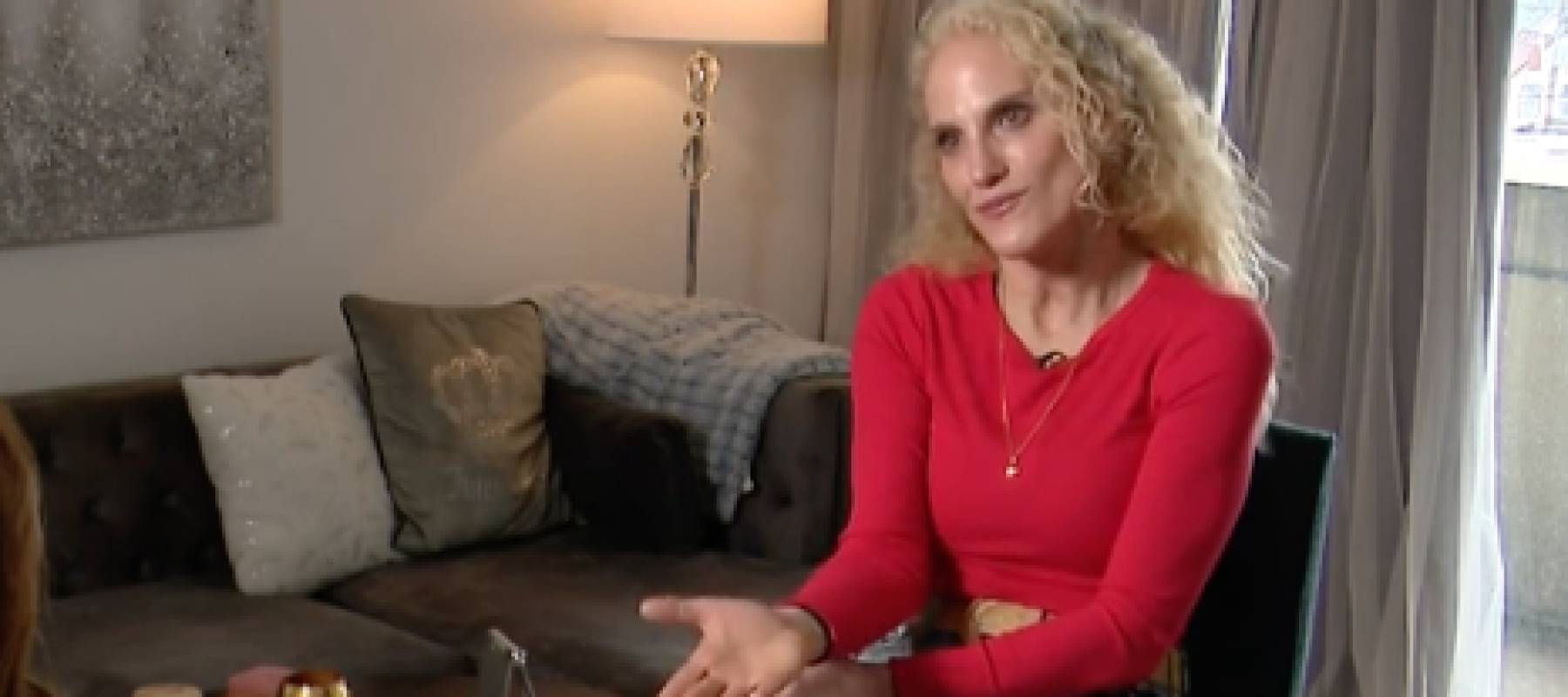Woman talks to a reporter.