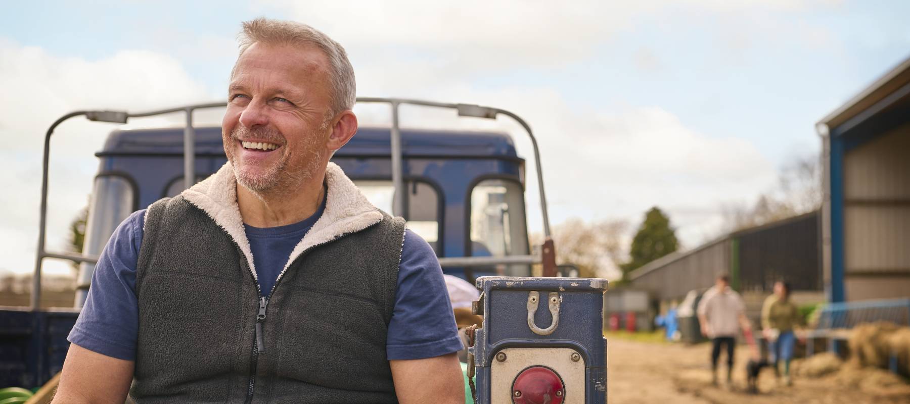 A mature man on break from working the farm.