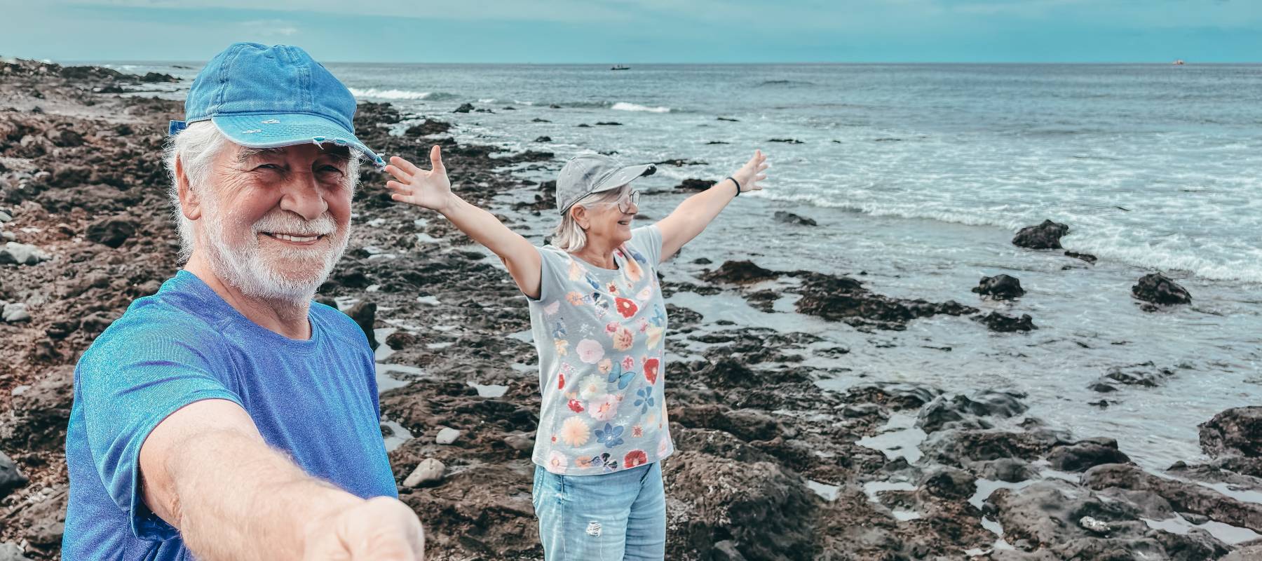 Elderly couple enjoying time at the beach