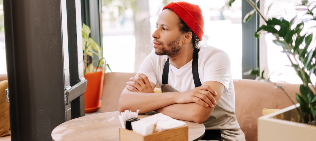 Barista sitting at table on break
