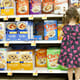 Little girl in grocery store cereal aisle