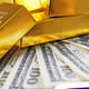 Gold bars with dollar banknotes on paper background