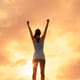 woman's silhouette, she is raising her arms in victory