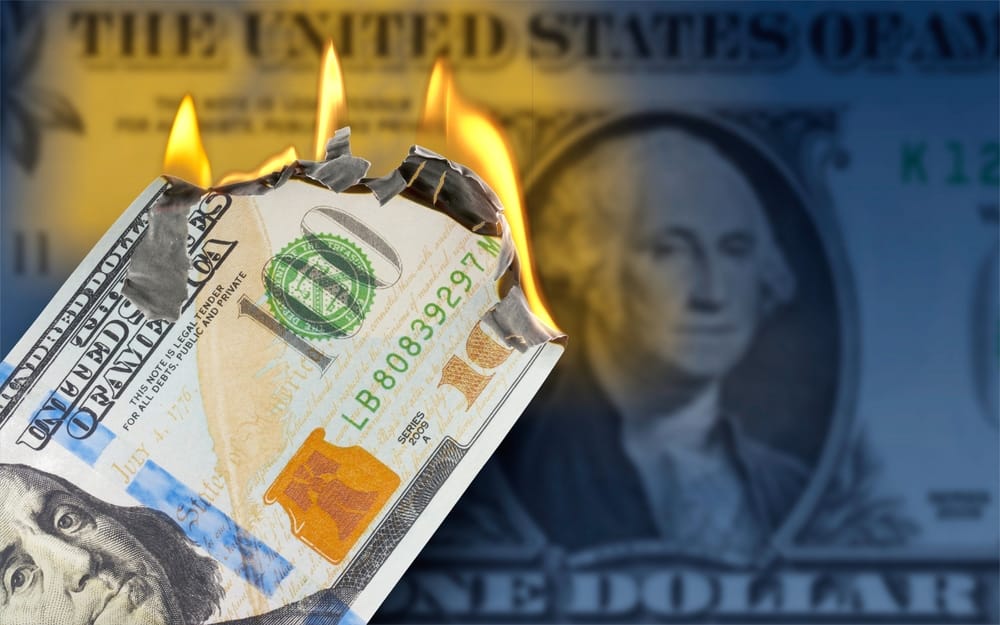 3D illustration, A burning 100 US dollar bill in front of One Dollar banknote