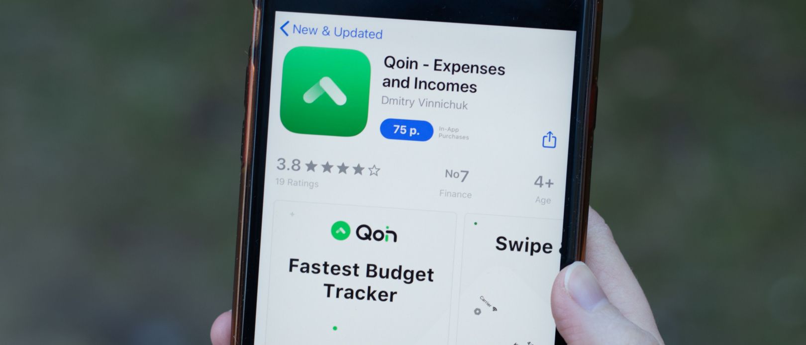 Qoin app logo close-up on phone screen