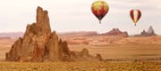 Hot Air Balloon Flying Over New Mexico Desert Landscape