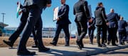Members of the Air Line Pilots Association demonstrate amid contract negotiations outside the WestJet headquarters in Calgary, Alta., Friday, March 31, 2023. The union representing 8,000 Cana