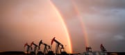 A rainbow appears to come down on pumpjacks drawing out oil and gas from wells near Calgary, Alta., Monday, Sept. 18, 2023. 