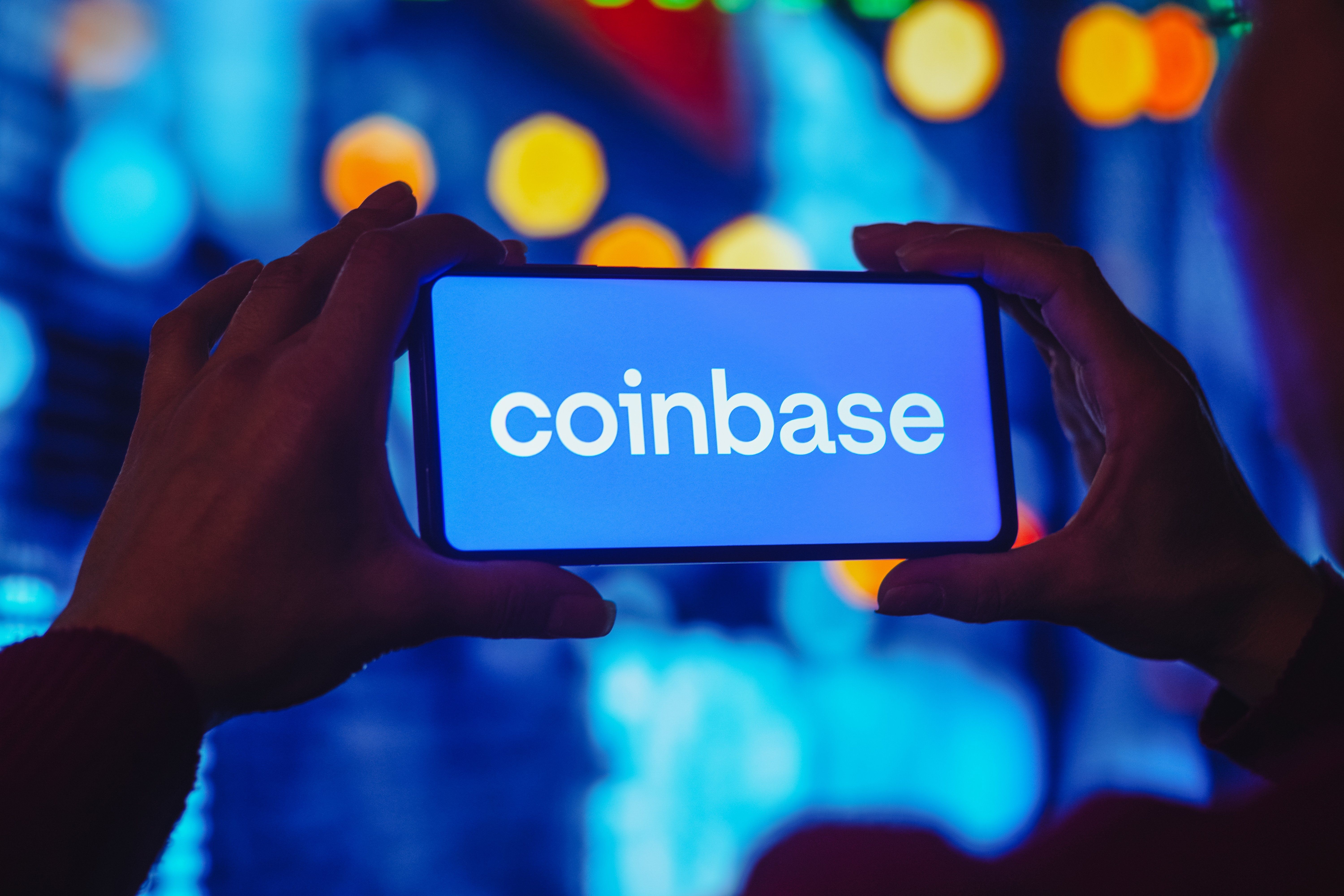 In this photo illustration the Coinbase logo seen displayed on a smartphone