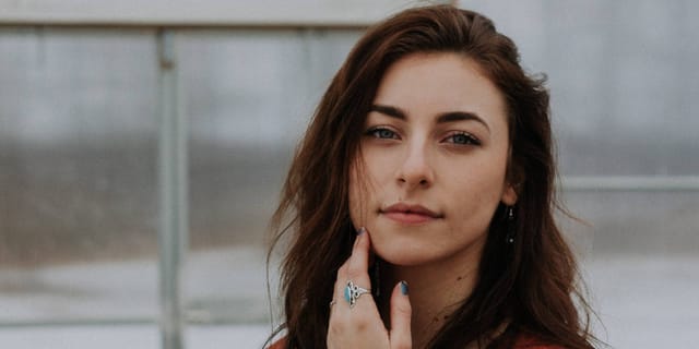 Brunette woman in red sweater