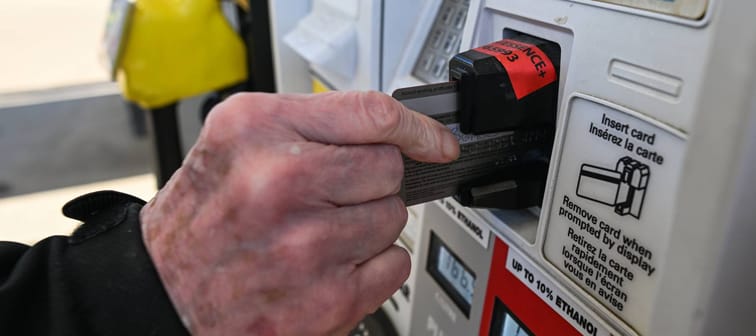 Man paying for gas with a credit card