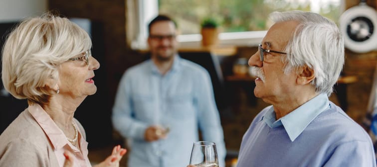 Senior couple discussing while standing in the kitchen