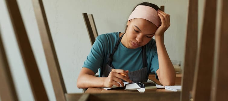 Woman using a calculator on the job