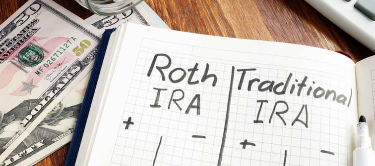 Roth IRA vs Traditional IRA written in the notepad.