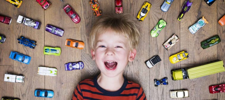 Boy with toy cars
