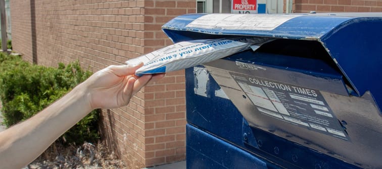 Package going into USPS mailbox