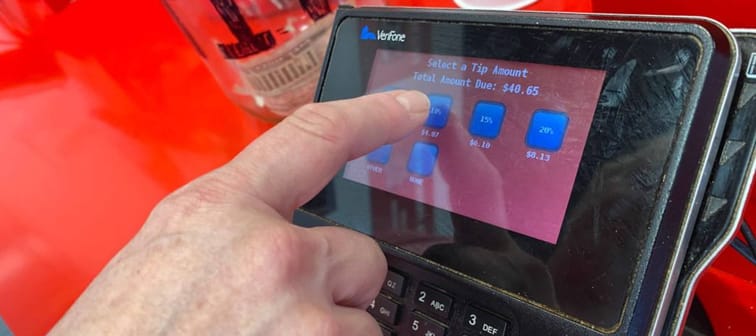 Leaving a tip at a point-of-sale machine.