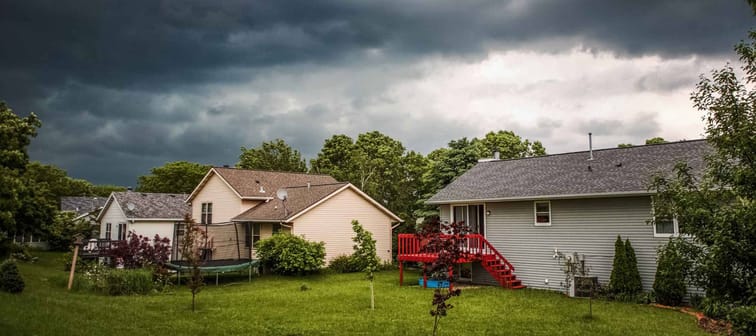 Thuderstorm clouds over suburban houses