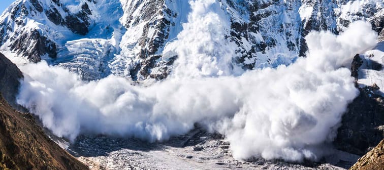 Power of nature. Real huge avalanche comes from a big mountain, Shkhara, 5.193 m, Caucasus, Kabardino-Balkaria, Bezengi region, Russia