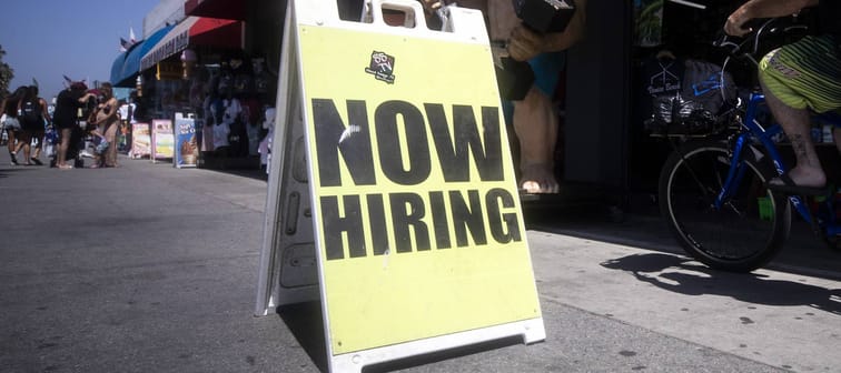 A sign on the walkway next to a shop reads 'Now Hiring' close to the beach amid the coronavirus pandemic in Venice Beach, California, Sept. 5, 2020.
