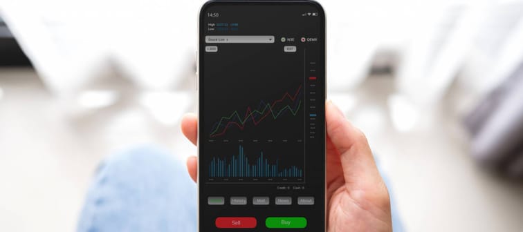 A person looking at a stock app on a phone