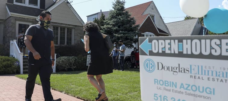 People wait to visit a house for sale in Floral Park, Nassau County, New York, the United States, on Sept. 6, 2020.