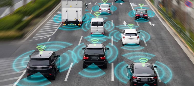 connected cars illustration. cars on road with wifi signals around them