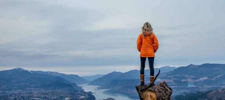A woman looking at the Columbia River near Hood River in the Columbia River Gorge, Oregon, USA