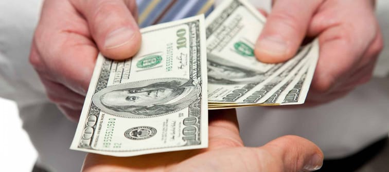 Human hands exchanging money - closeup shot