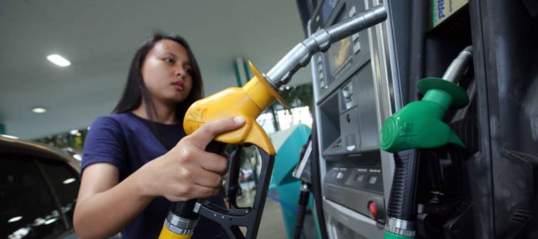 Kuala Lumpur/Malaysia-December 4 2019- A women refuel her car with petrol at Petronas gas station in Kuala Lumpur