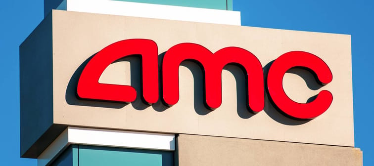 AMC logo above the movie theater on a sunny day under blue sky