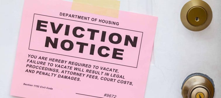 Pink Eviction Notice Taped on Front Door.
