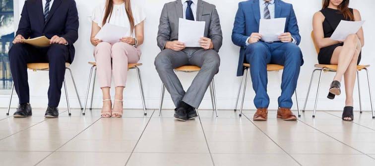 Five candidates waiting for job interviews, front view, crop