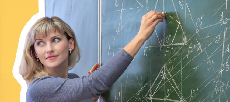 Female teacher at blackboard teaching angles