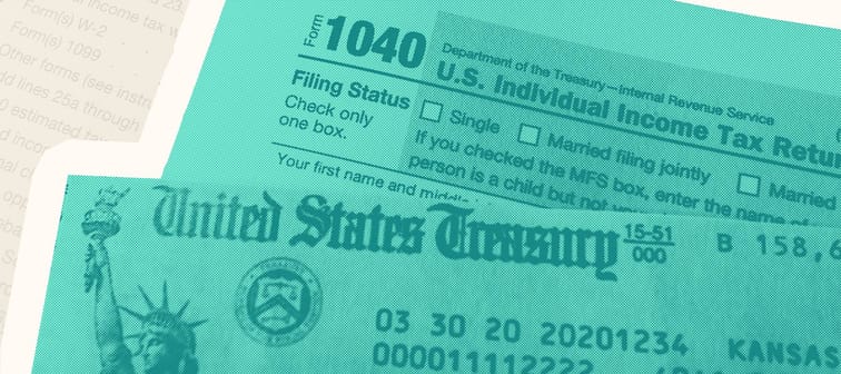 A U.S. Treasury tax refund check and a 1040 tax form